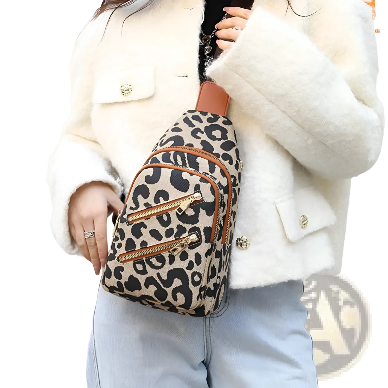 Leopard print crossbody bag with headphone jack featuring tan leather trim and gold tone zippers