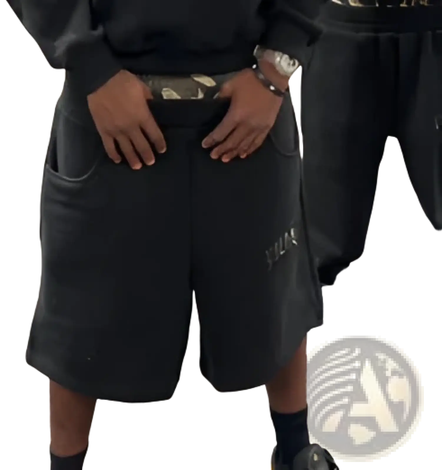 Black athletic shorts with subtle logo and camouflage belt paired with leopard print hoodie and sweatpants set