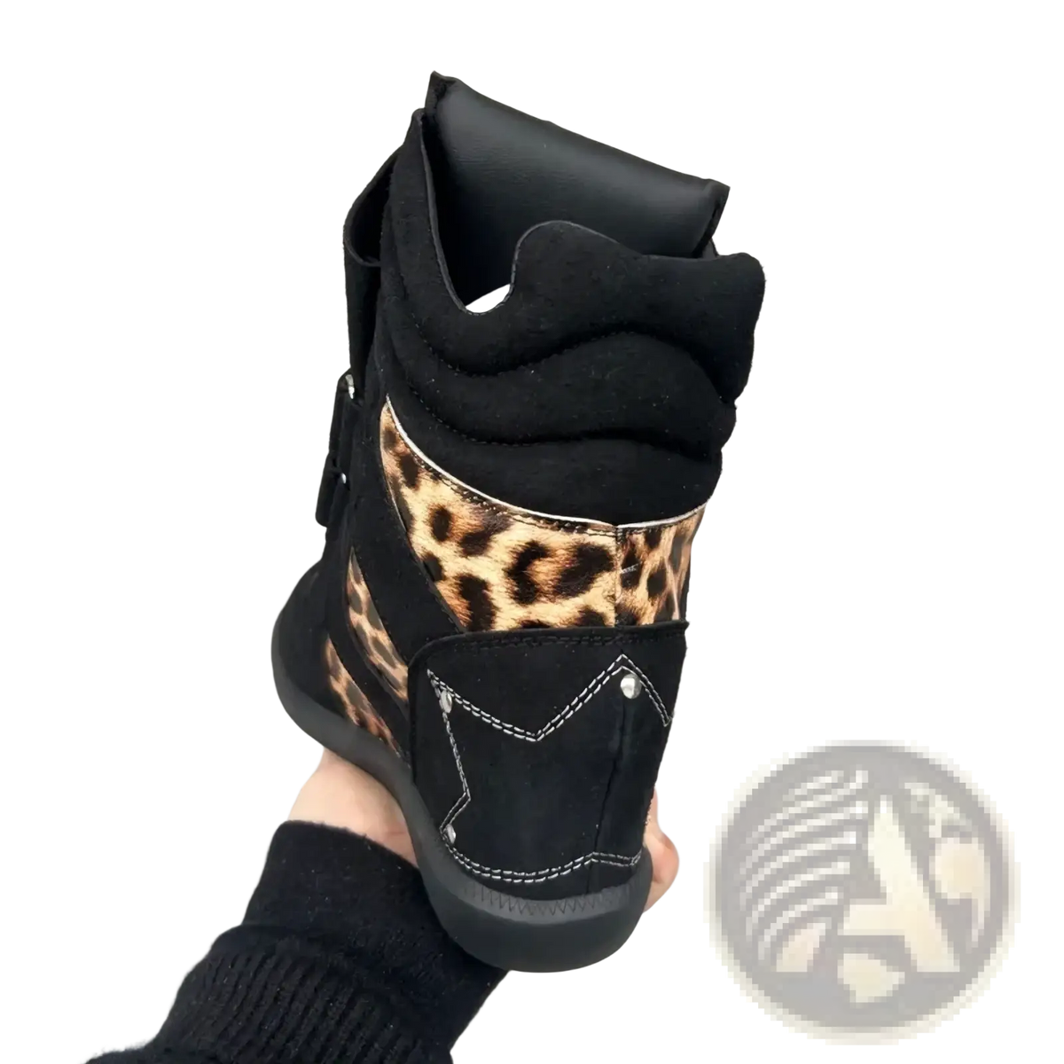 Black high-top wedge ankle boot with leopard print suede accents combining style and comfort