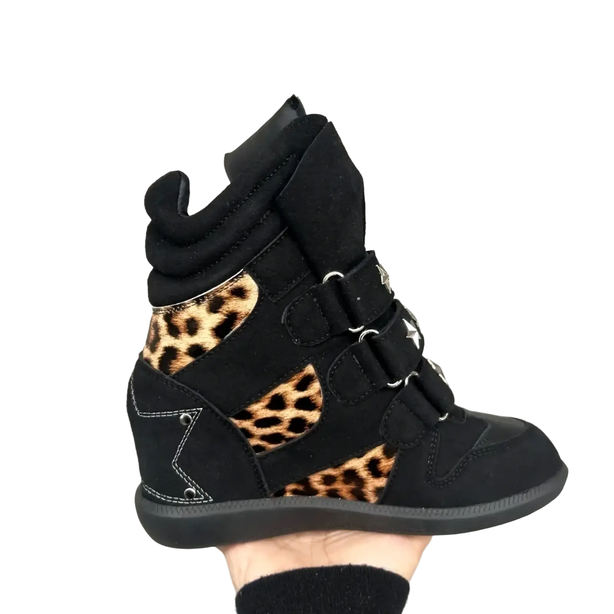 Black suede wedge sneaker with leopard print accents and star shaped metal buckles in leopard print wedge ankle boots