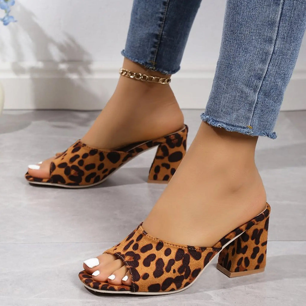 Leopard square toe chunky heel sandals featuring leopard print with open toe design and mule style silhouette