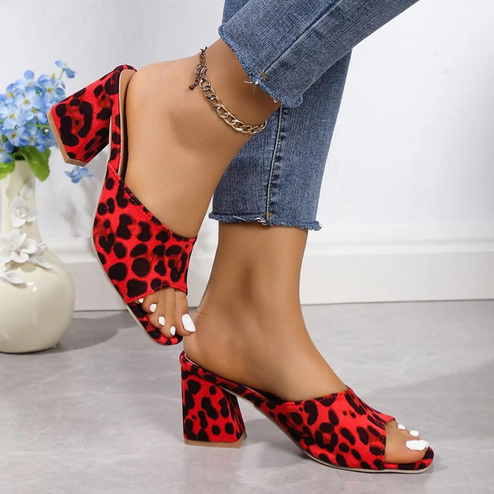 Leopard square toe chunky heel sandals in red and black leopard print with a block heel and mule design
