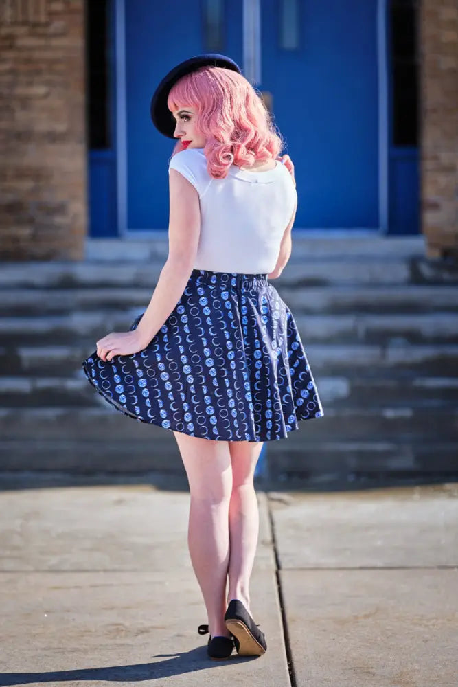 Plus size navy pleated skater skirt with white skull and crescent moon celestial pattern