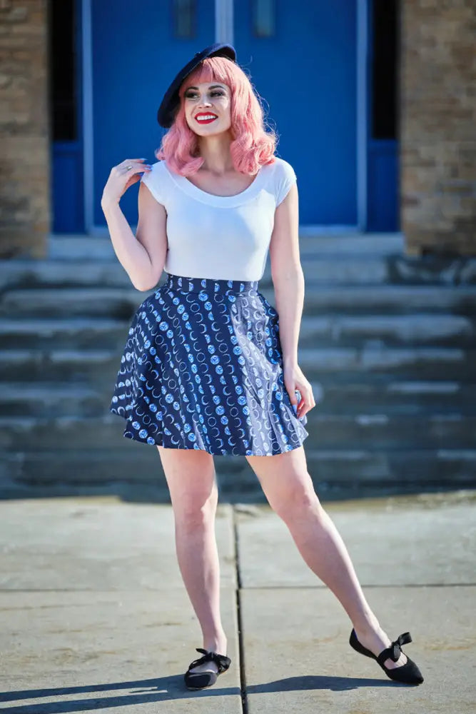Plus size navy pleated skater skirt with white celestial moon and star pattern for stylish casual wear