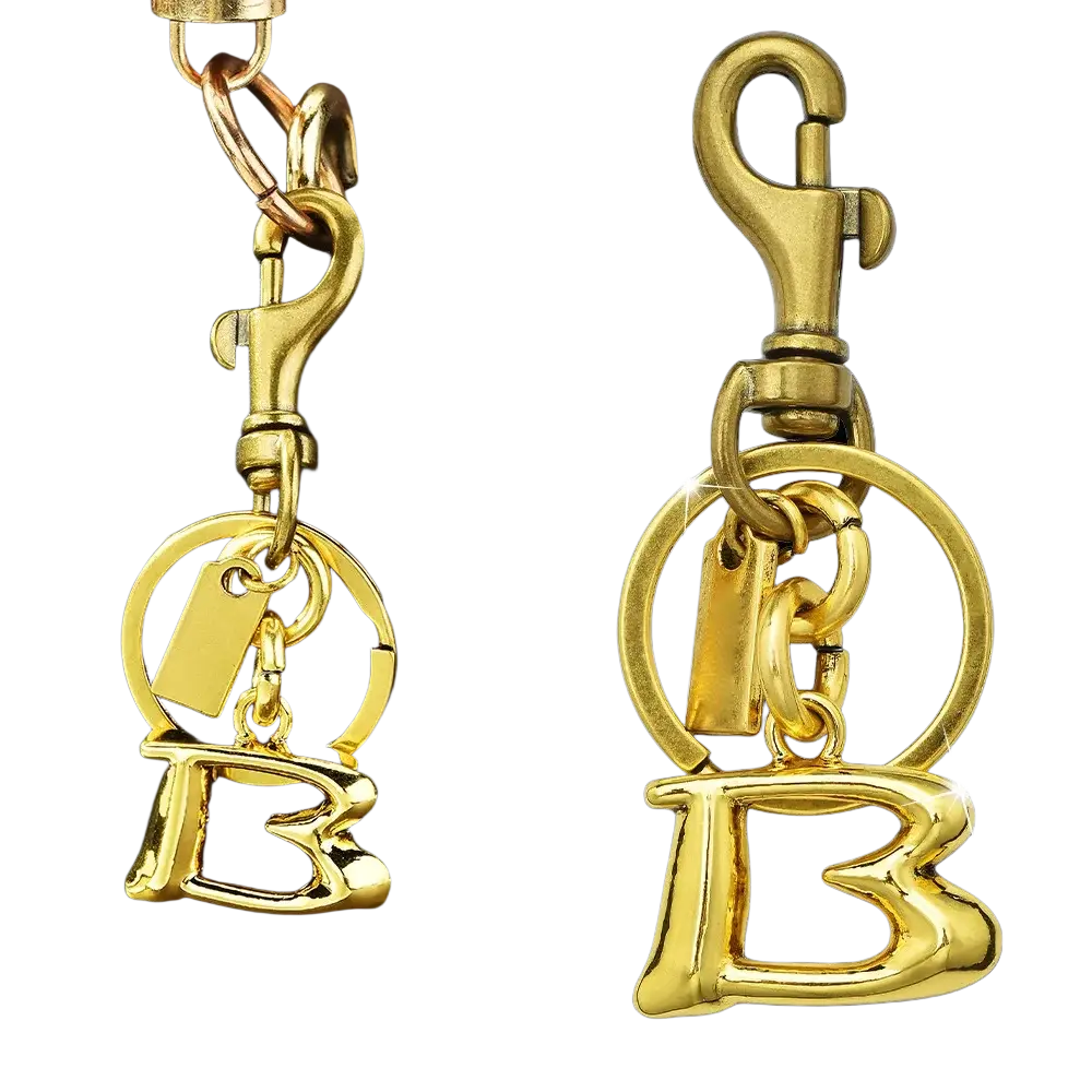 Gold metal keychain with a polished letter b charm and lobster clasp for car accessory use