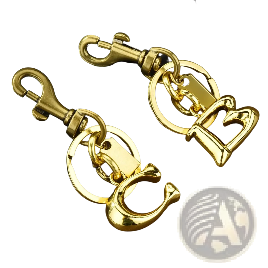 Gold metal keychain with letter b and c initials featuring a sturdy swivel hook for car accessory use