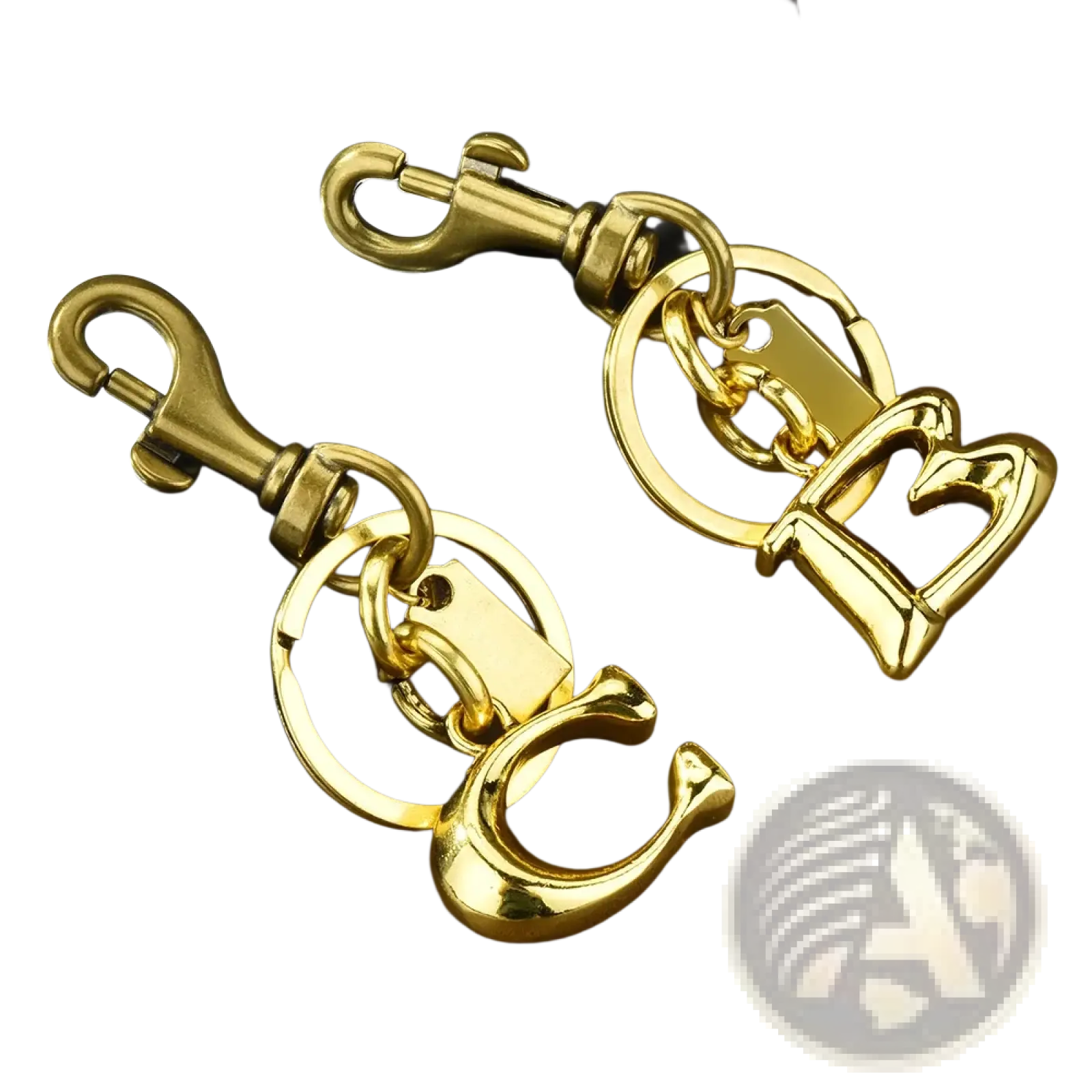 Gold metal keychain with letter b and c initials featuring a sturdy swivel hook for car accessory use