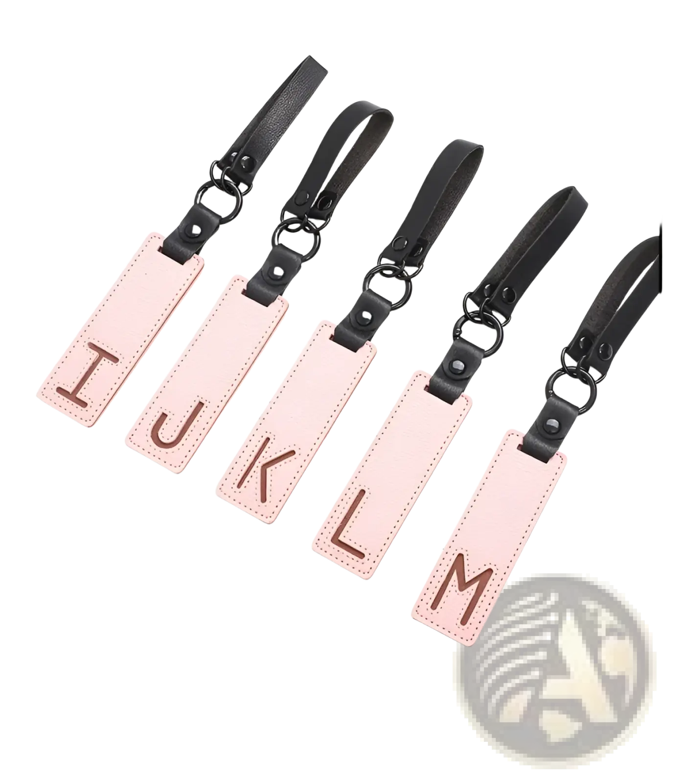 Pink leather luggage tags with black straps and metal rings featuring brown embossed uppercase letters for alphabet keychains