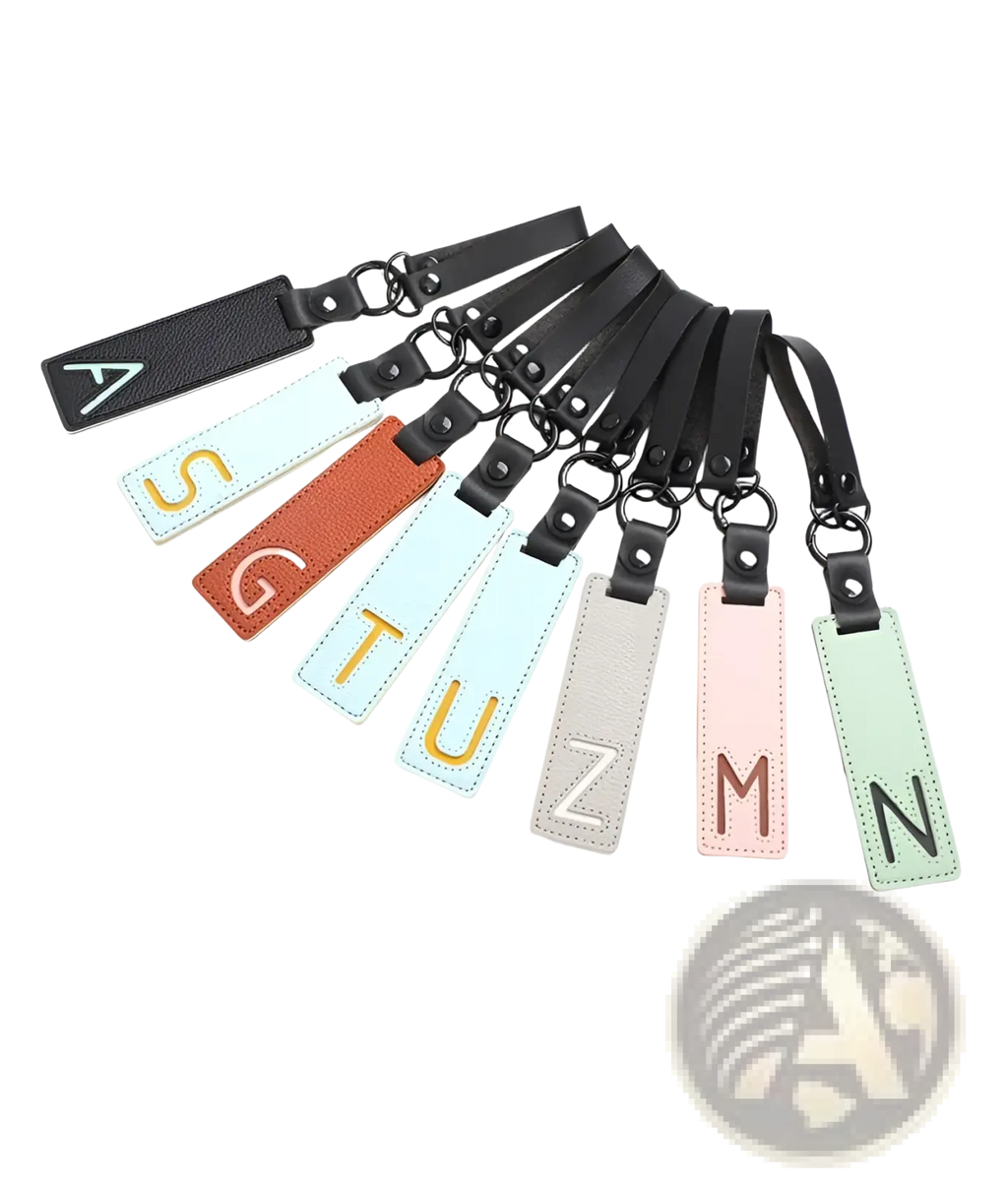 A set of colorful leather luggage tags with embroidered letters and black straps for keychain alphabet party gifts