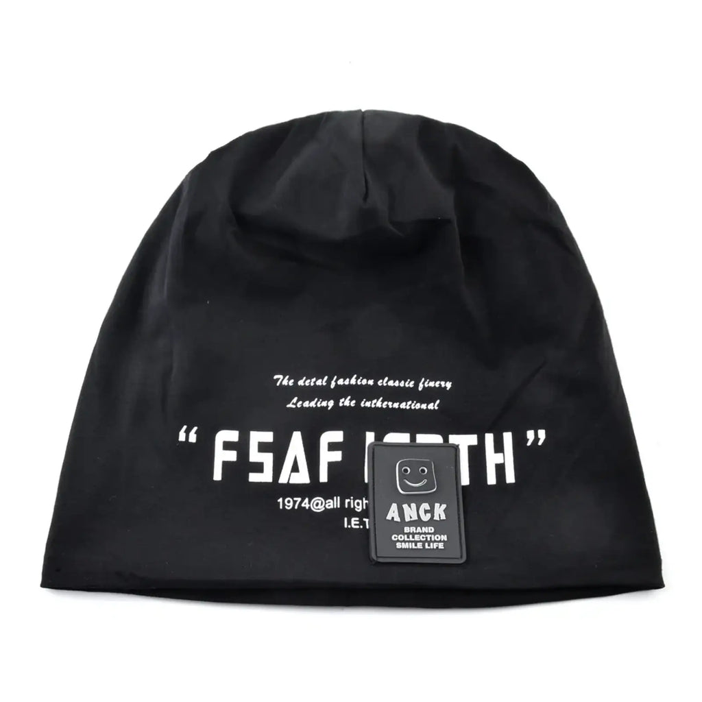 Black knit beanie hat with white letter print and small black anck brand patch for casual streetwear use