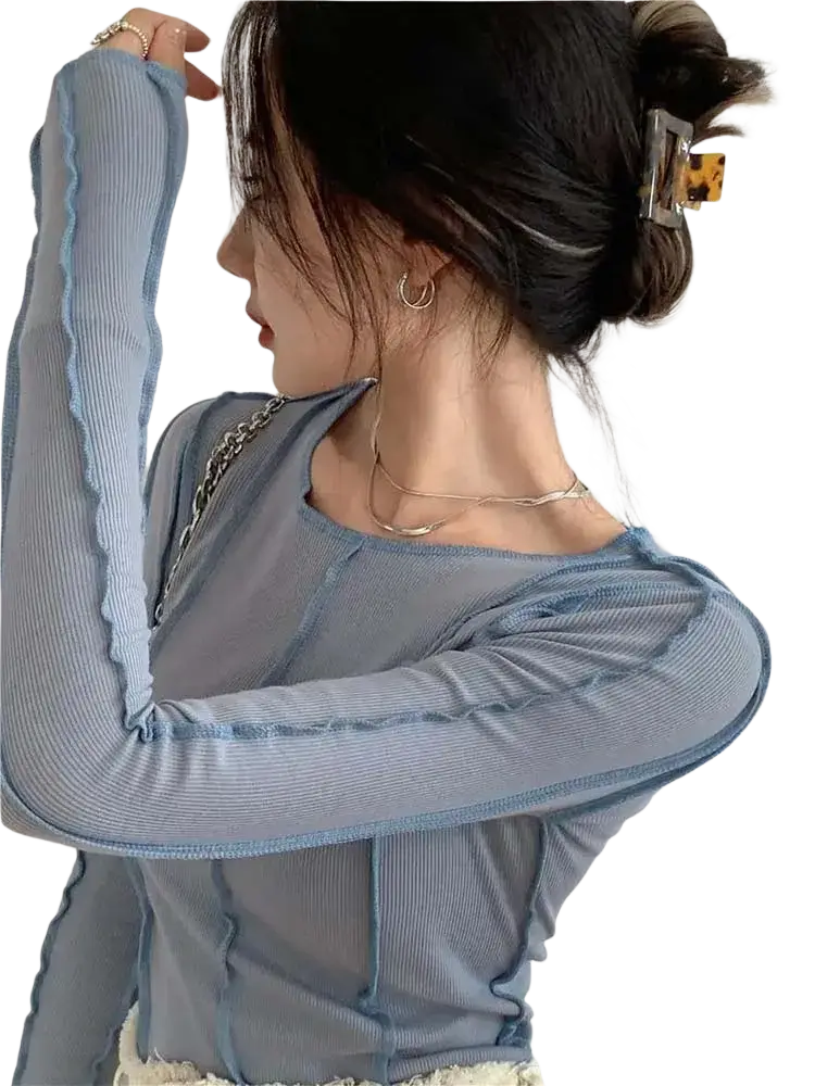 Light blue ribbed long sleeve top for women with sheer mesh panels and ruffled edges for casual wear