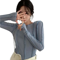 A light blue ribbed long sleeve top for women with slim fit and ruched detailing for casual wear