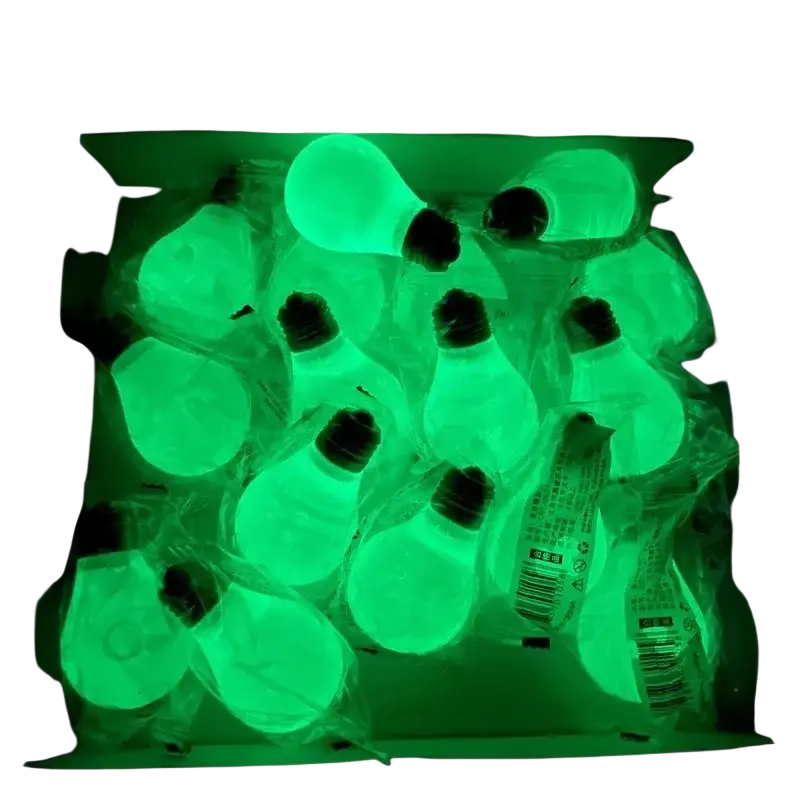 Green glowing light bulb squeeze toys with black bases wrapped in clear plastic for sensory stress relief