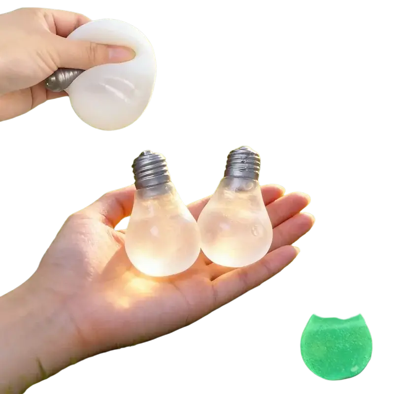 Translucent white light bulb stress relief squeeze toy with metallic screw base designed for stress relief use