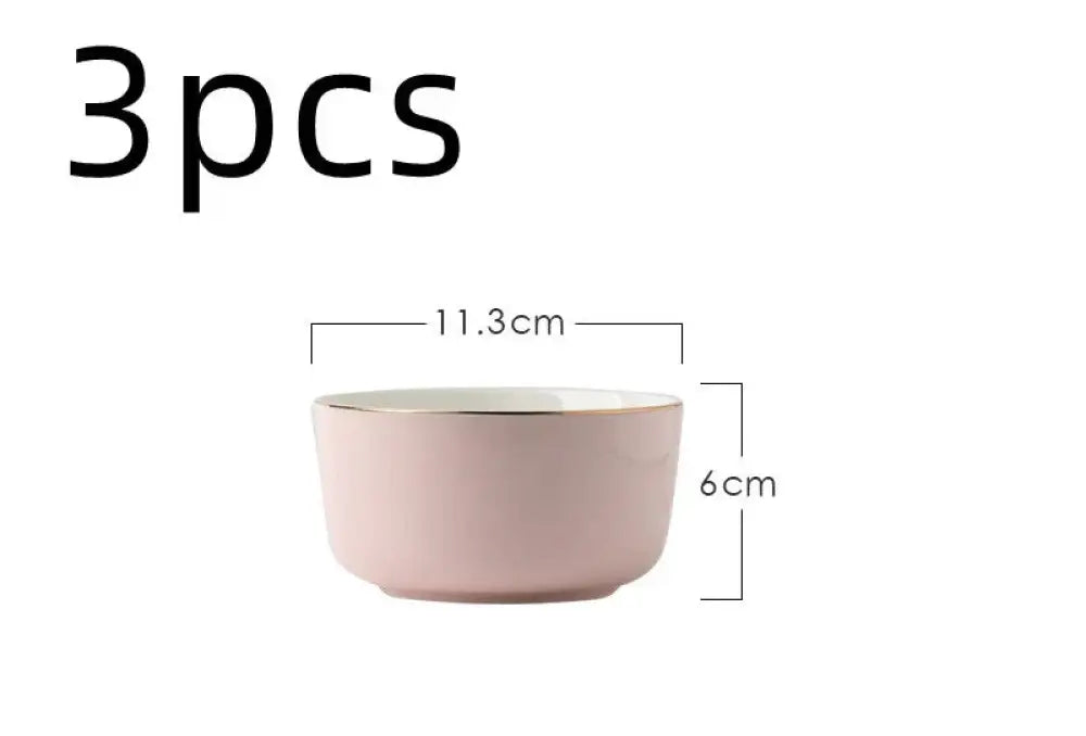 A soft pink ceramic bowl with a matte finish and gold rim from the luxury pink and gold script couple dinnerware set