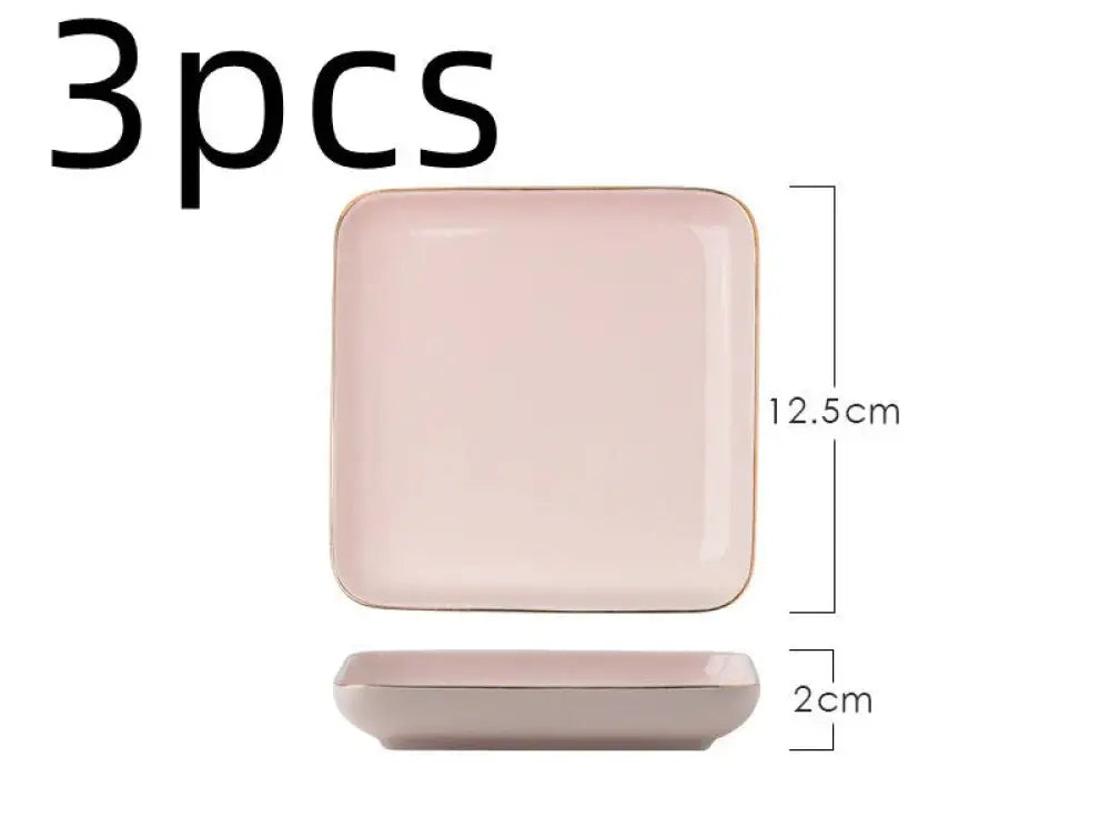 Set of three square ceramic plates with soft blush pink glaze and delicate gold rim from luxury pink and gold dinnerware set