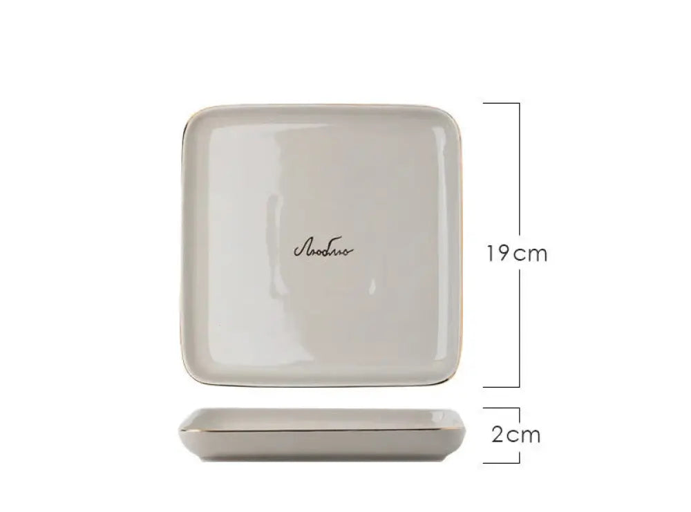 A sleek off-white ceramic square dish with rounded edges from the luxury pink and gold script ceramic couple dinnerware set