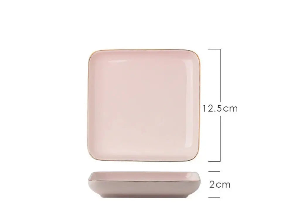 A square-shaped ceramic plate with soft pink glaze and subtle gold trim from the luxury pink and gold script couple dinnerware set