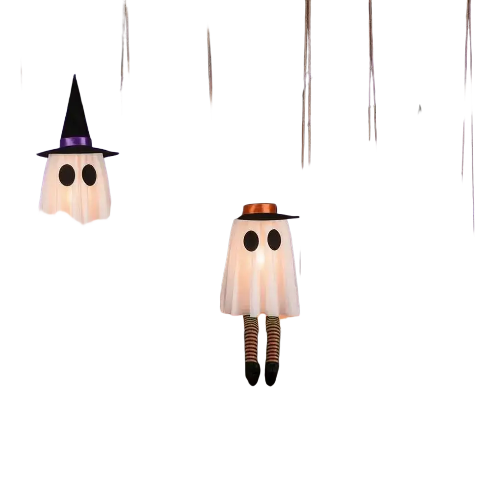Three glowing white swing ghost decorations with witch hats and striped leggings hanging from tree branches for outdoor halloween ghost decor
