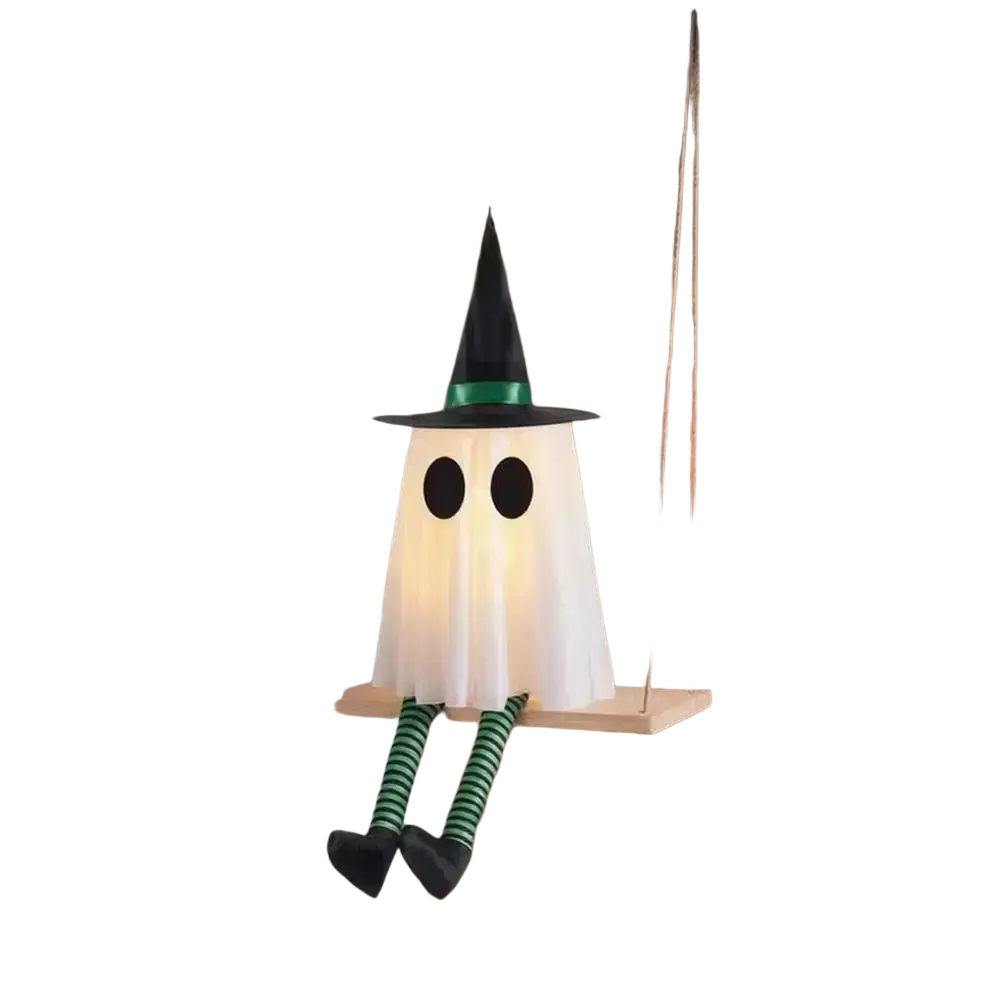 A glowing white swing ghost decoration with black eyes and a green witch hat for outdoor halloween ghost decor