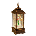 Antique bronze lantern with lighted snowman figurine inside surrounded by glittering faux snow and twinkling lights