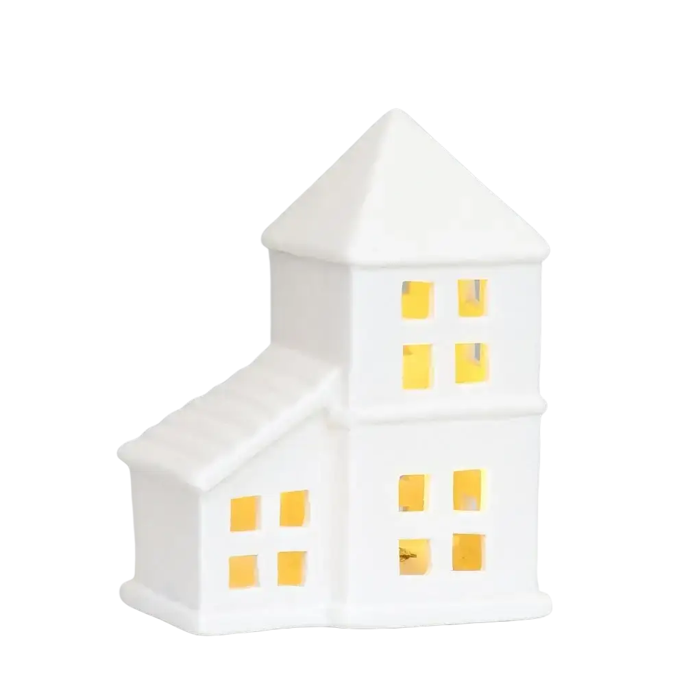 White ceramic christmas village house lantern with glowing yellow led light for enchanting winter wonderland decor