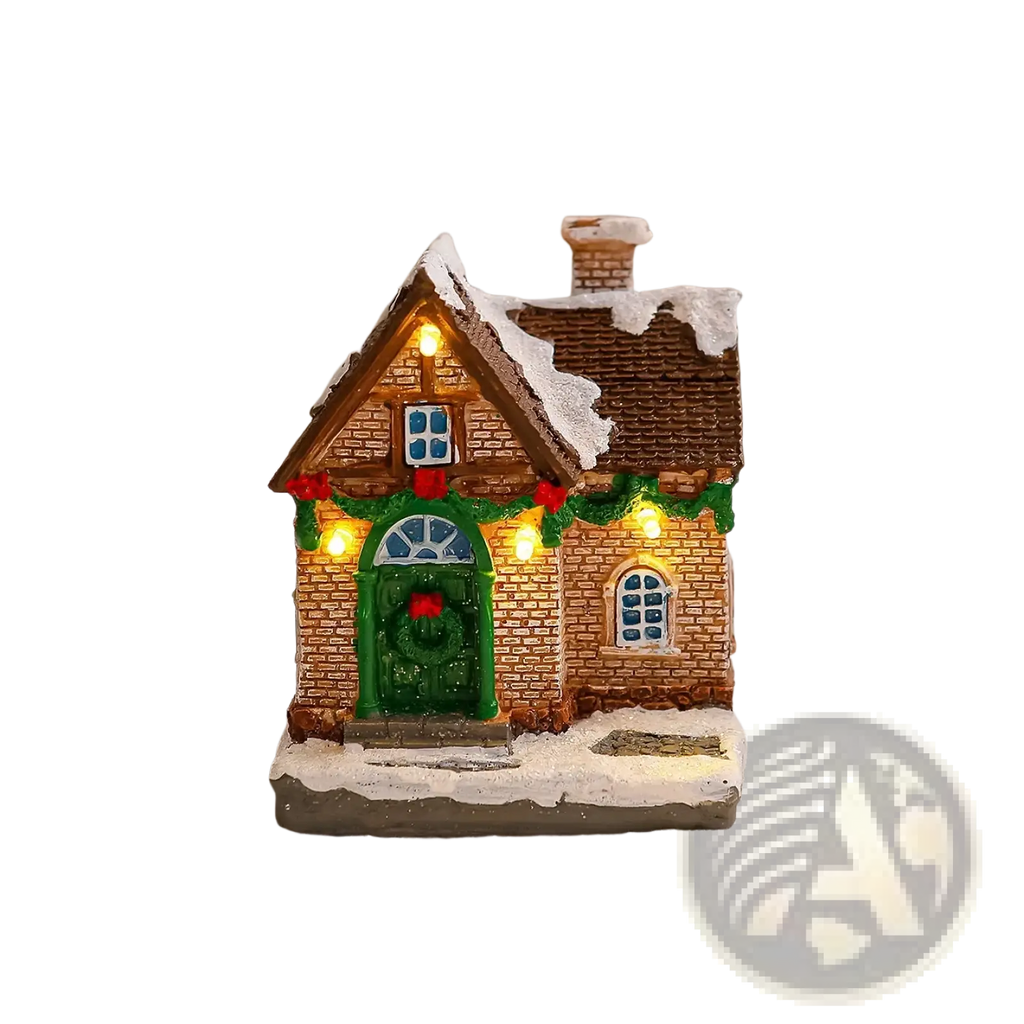 Lighted Christmas village house ornament with brown brick facade, green door, blue glass windows, and snow-dusted roof