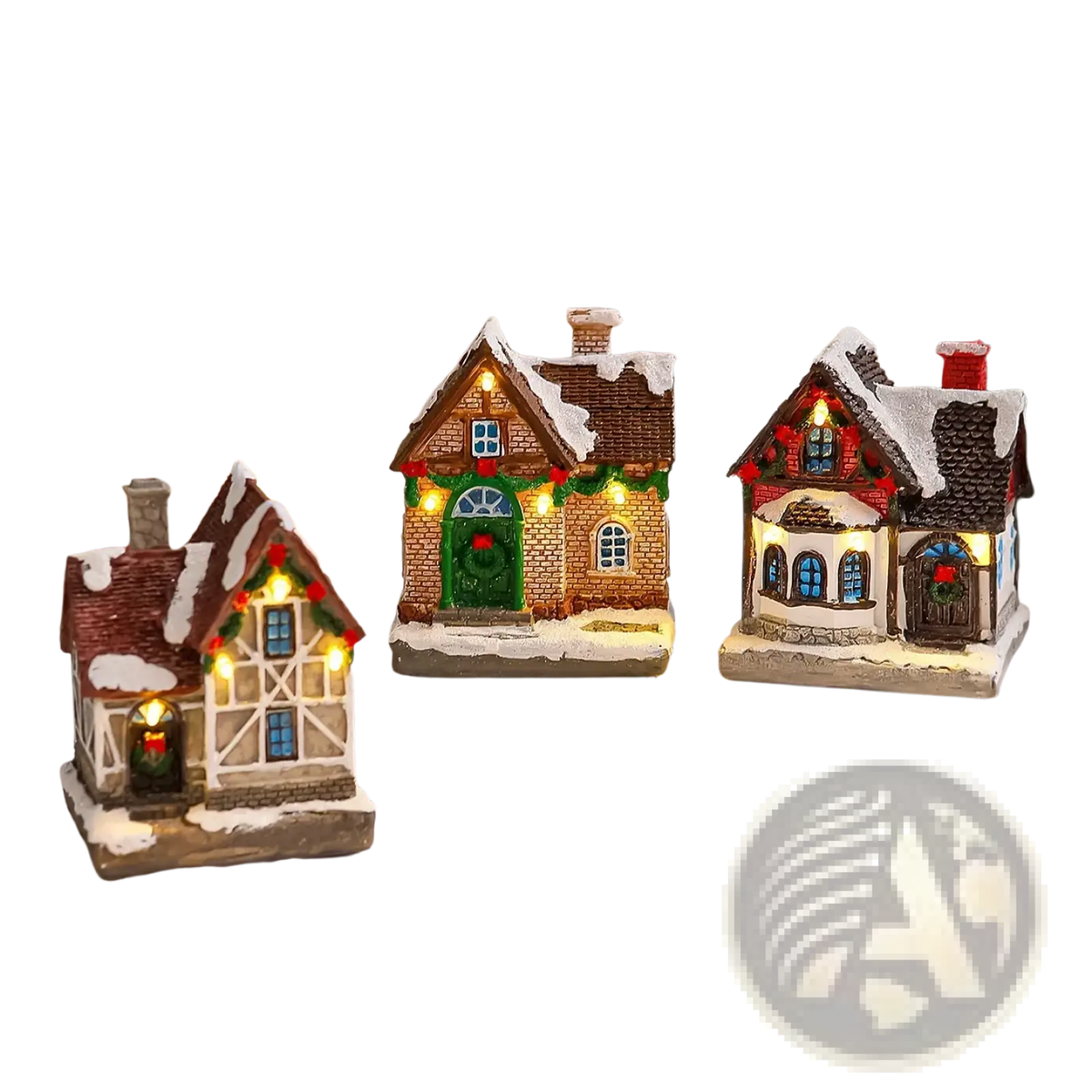 Three miniature lighted christmas village house ornaments with snow-dusted roofs and festive wreath decorations