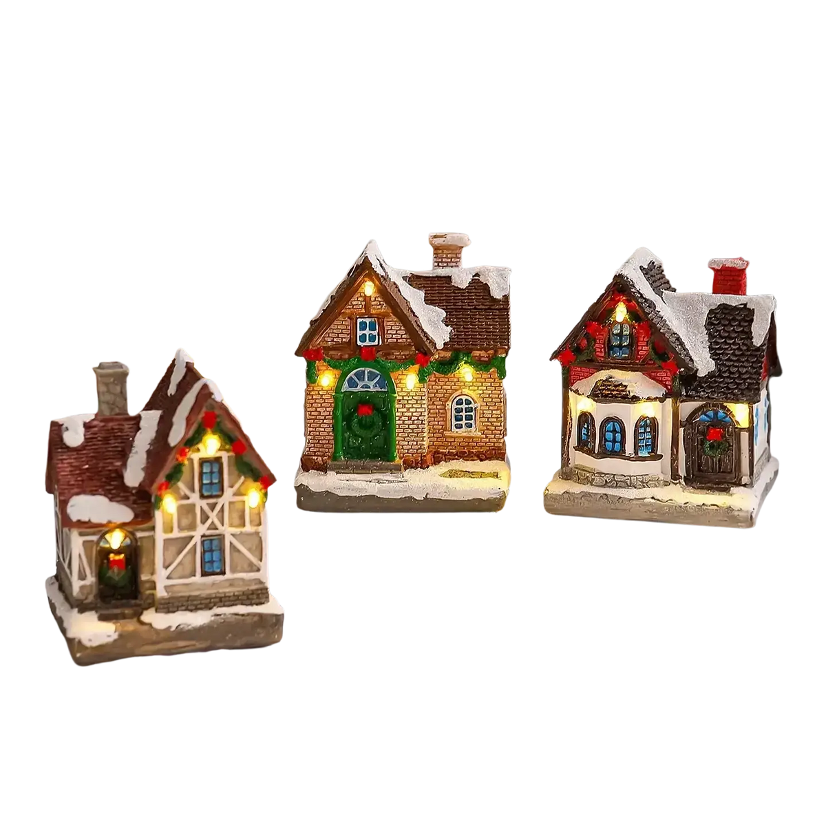 Three miniature lighted christmas village house ornaments with snow-dusted roofs and festive lights