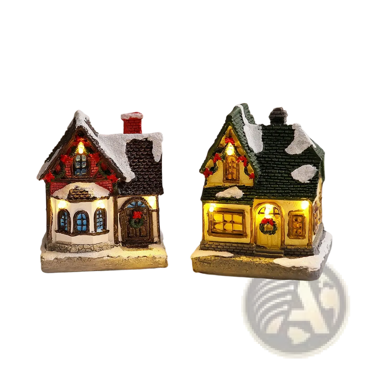 Two miniature lighted christmas village house ornaments with red and green roofs glowing warmly with festive accents