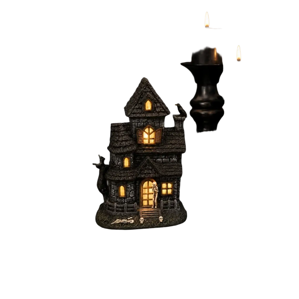 Lighted haunted house resin figurine in black with glowing yellow windows and skeleton at the entrance