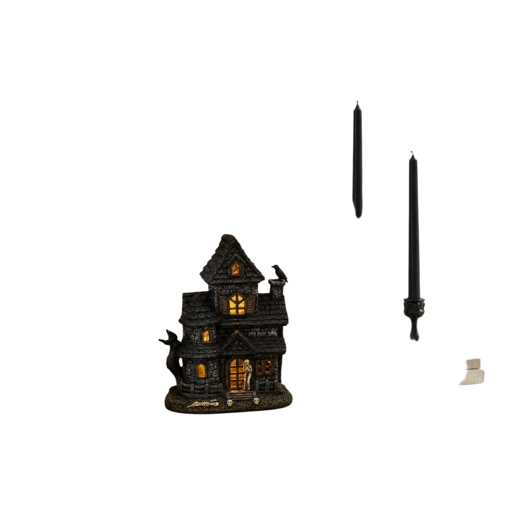 Black lighted haunted house resin figurine with skeleton features glowing orange windows and textured dark surface