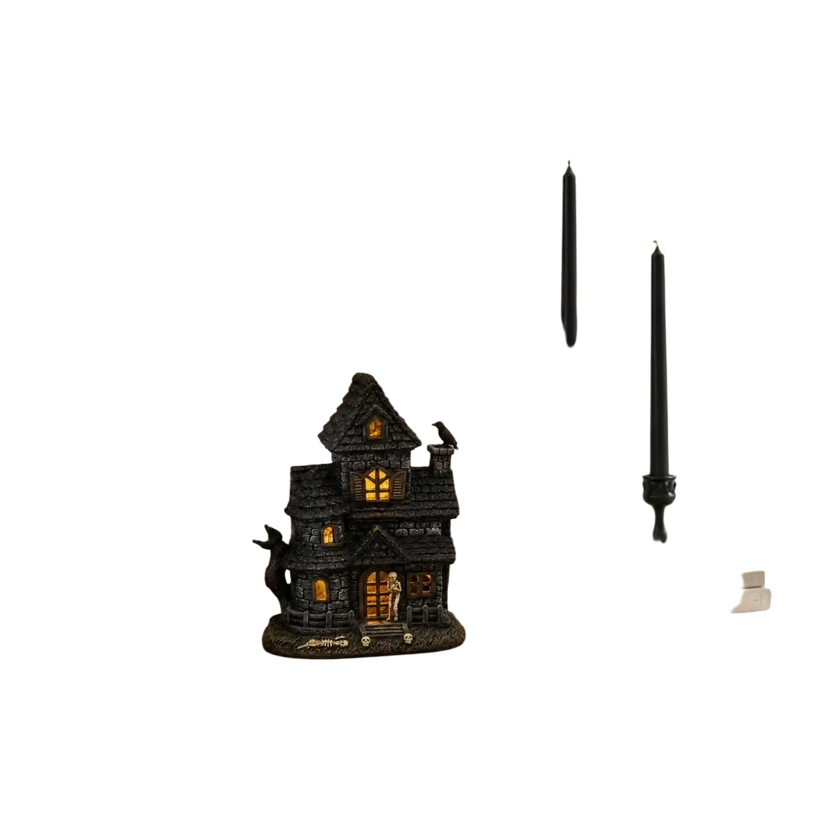 Black lighted haunted house resin figurine with skeleton features glowing orange windows and textured dark surface