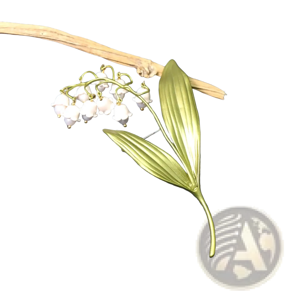 Delicate gold-toned lily of the valley pearl brooch pin with white enamel blossoms and detailed leaf design