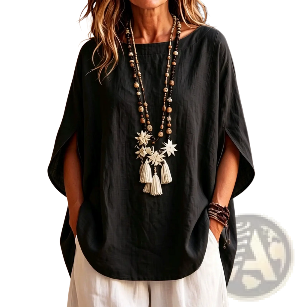 Black linen cape top with relaxed fit batwing sleeves made of loose cotton fabric for comfortable wear