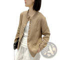 Beige linen patchwork jacket with button closure and subtle texture in a relaxed fit style
