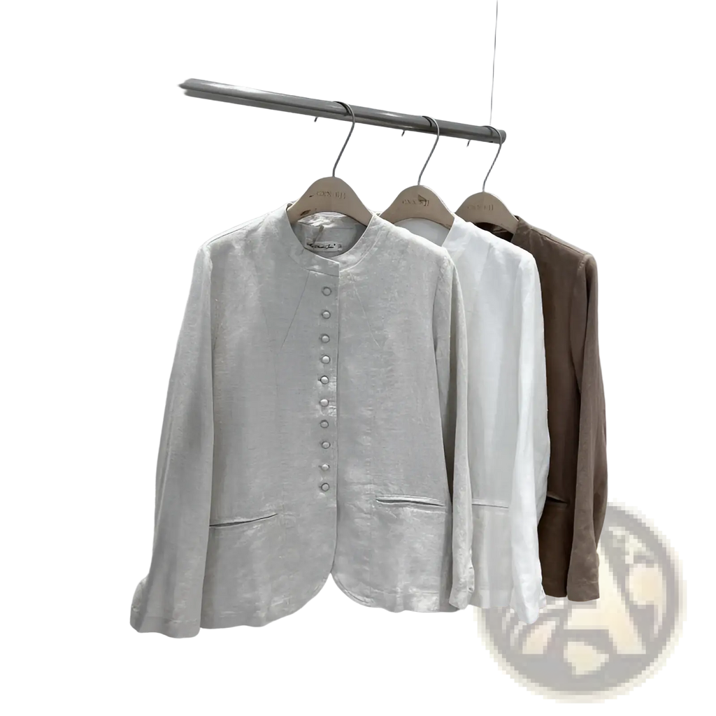A light gray linen patchwork jacket with long sleeves round neckline and button closure in relaxed fit