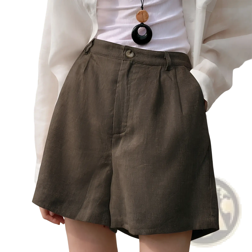 Olive green linen shorts with subtle textured pattern and button closure suitable for casual loose fit wear