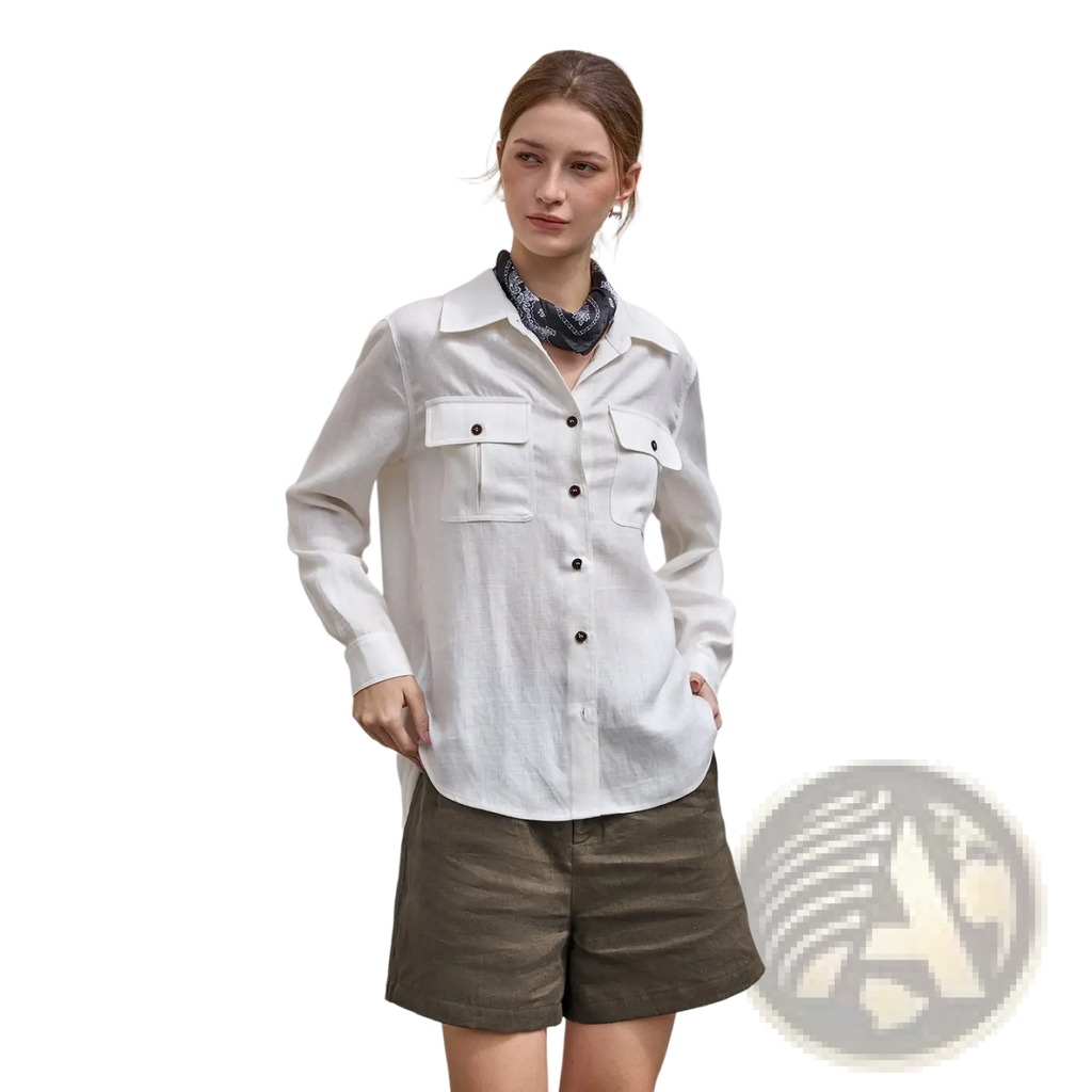 White long-sleeved linen shirt with black buttons and chest pockets paired with loose fit casual linen trousers