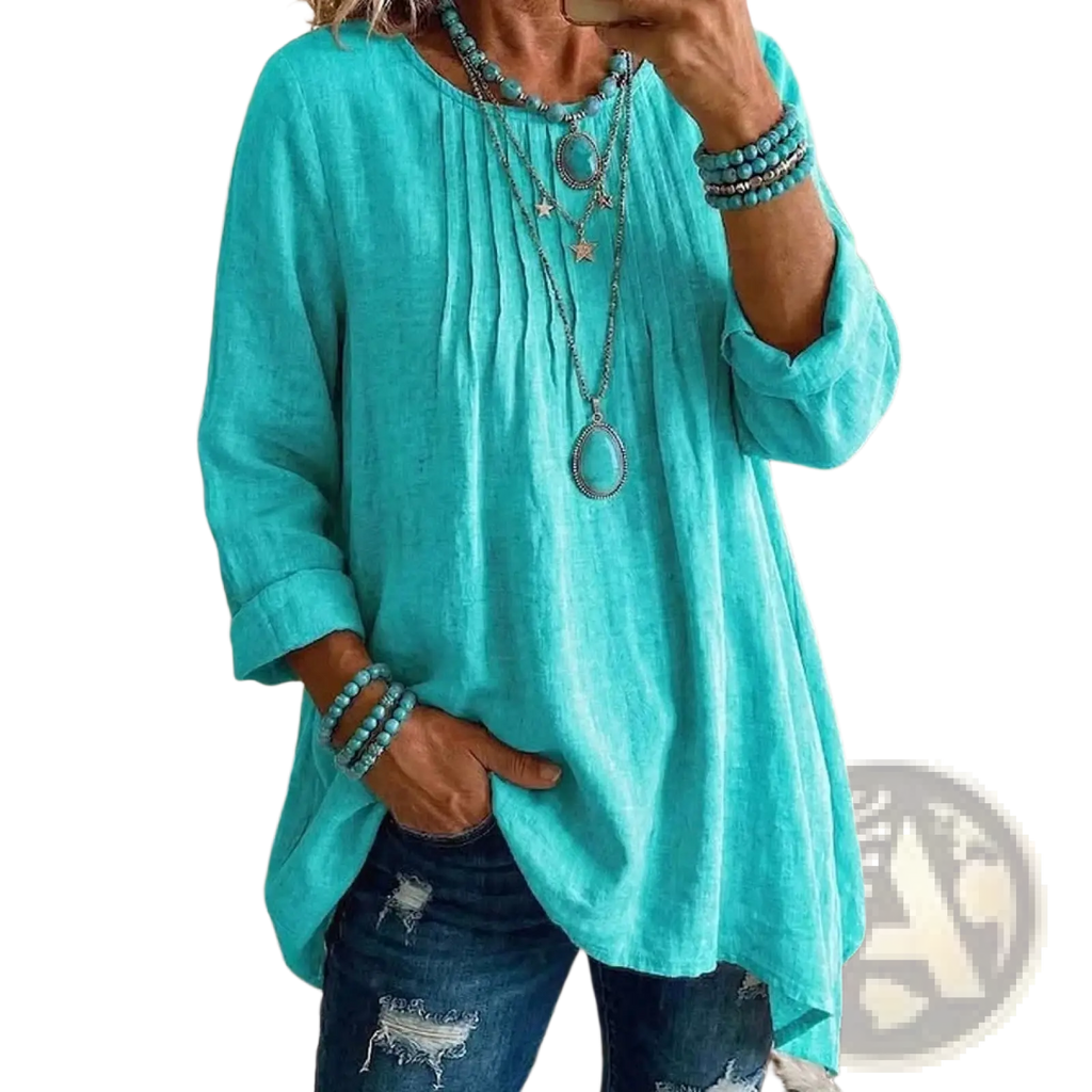 A flowing turquoise linen tunic with rolled sleeves and a relaxed fit casual long sleeve top