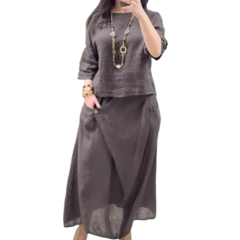 A flowing dark gray linen two piece set with ruffled sleeves and a draped midi skirt offering casual style and protection time delivery