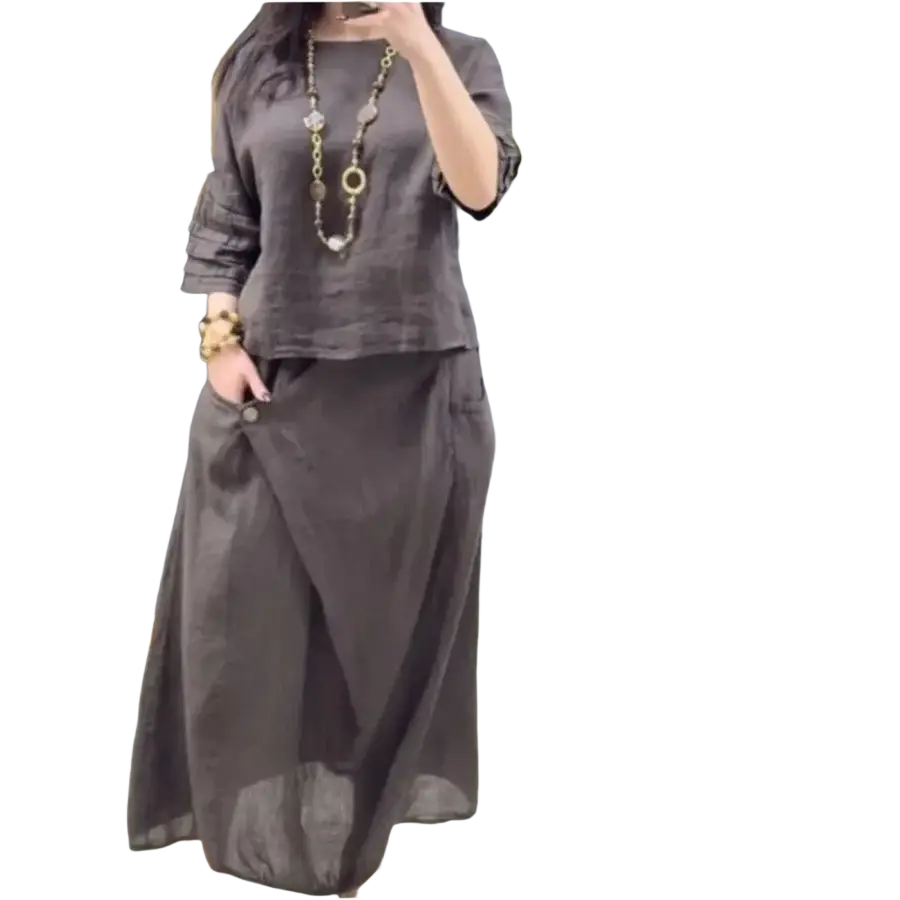Dark gray linen two piece set with ruffled sleeves and flowing midi skirt designed for casual wear and delivery protection time