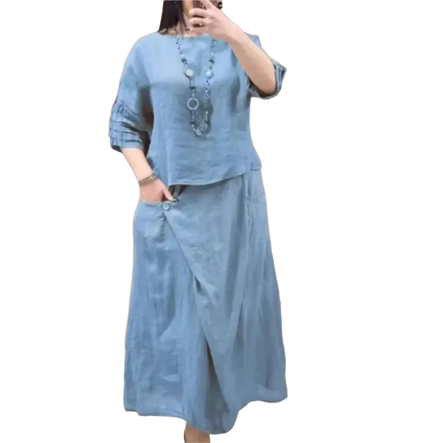 Light blue linen two piece set with ruffled sleeves and wrap skirt offering delivery protection time benefits