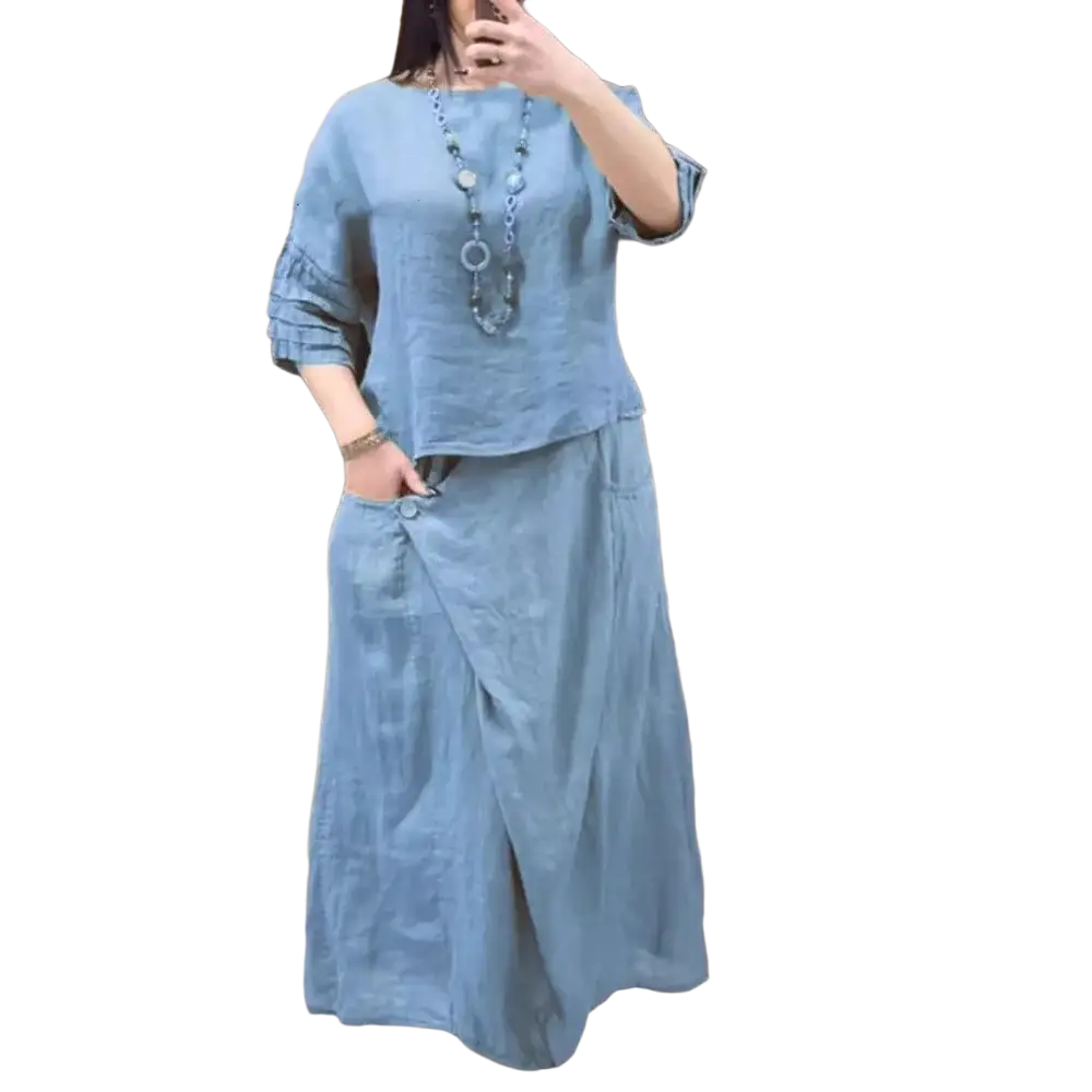 Light blue linen two piece set with ruffled sleeves and wrap-style midi skirt offering delivery protection time