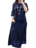 Navy blue linen two piece set with ruffled sleeves and flowing midi skirt offering stylish delivery protection time benefits