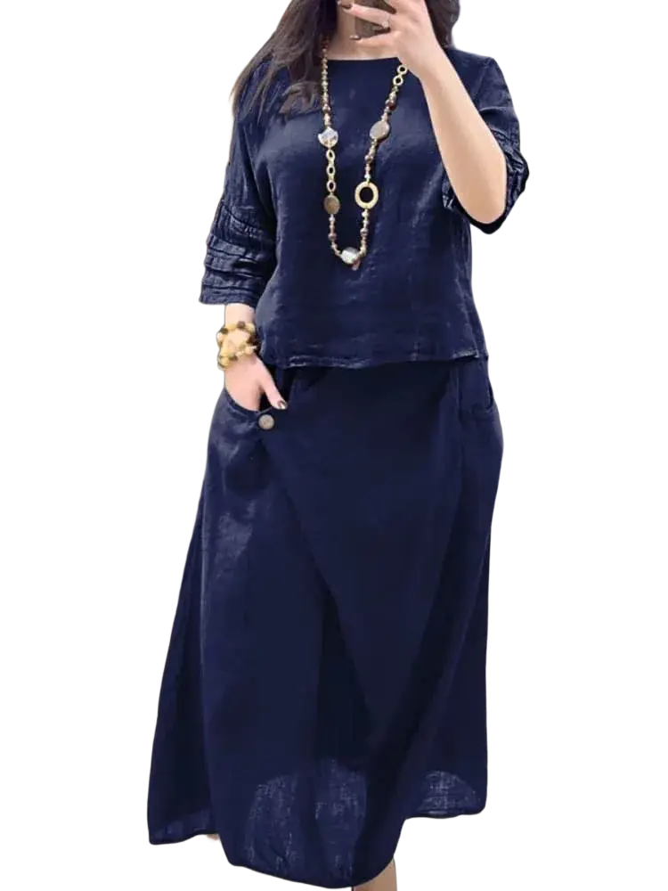 Navy blue linen two piece set with ruffled sleeves and flowing midi skirt offering stylish delivery protection time benefits