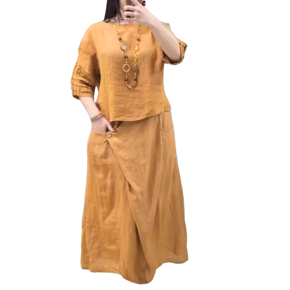 A warm amber linen two piece set with ruffled sleeves and asymmetrical skirt offering stylish protection time