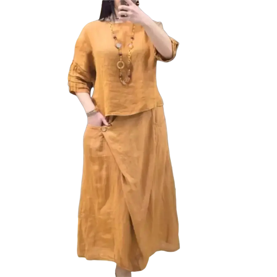 A warm amber linen two piece set with ruffled sleeves and draped skirt offering stylish delivery protection