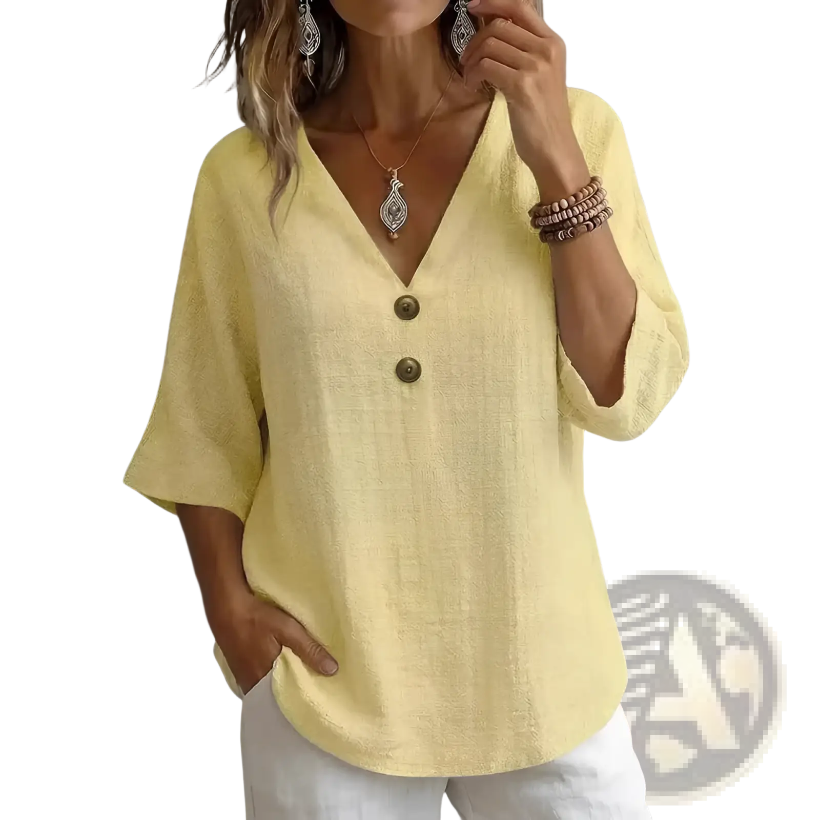 A soft yellow linen v-neck button top with textured fabric and three-quarter sleeves for casual wear