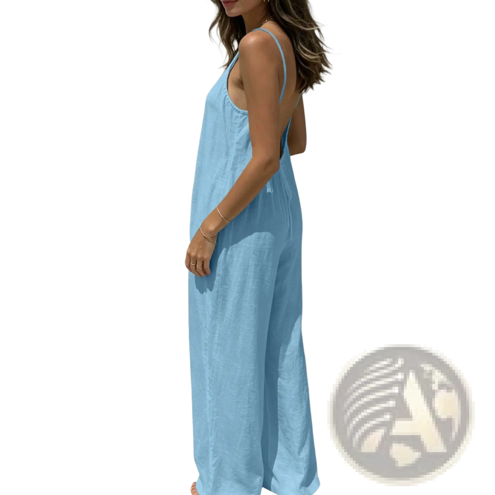 A light blue linen wide leg backless jumpsuit with thin straps and a relaxed sleeveless fit